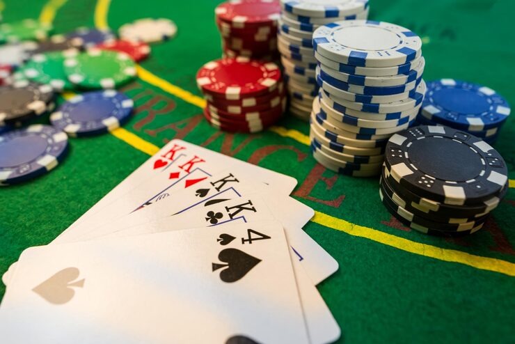 Live Baccarat table interface showing Banker, Player, and Tie betting zones with real-time card display